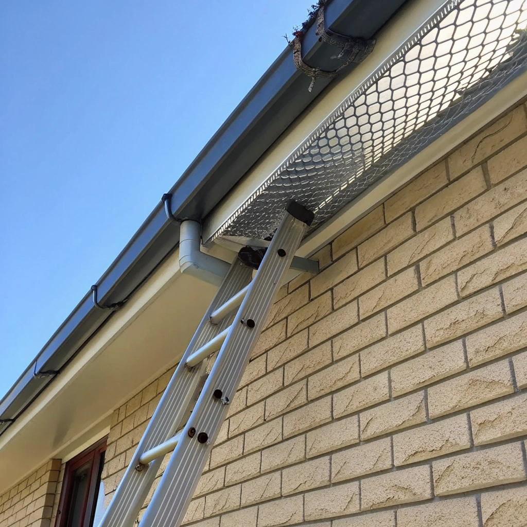 Seamless aluminum gutter system with leaf guards installed