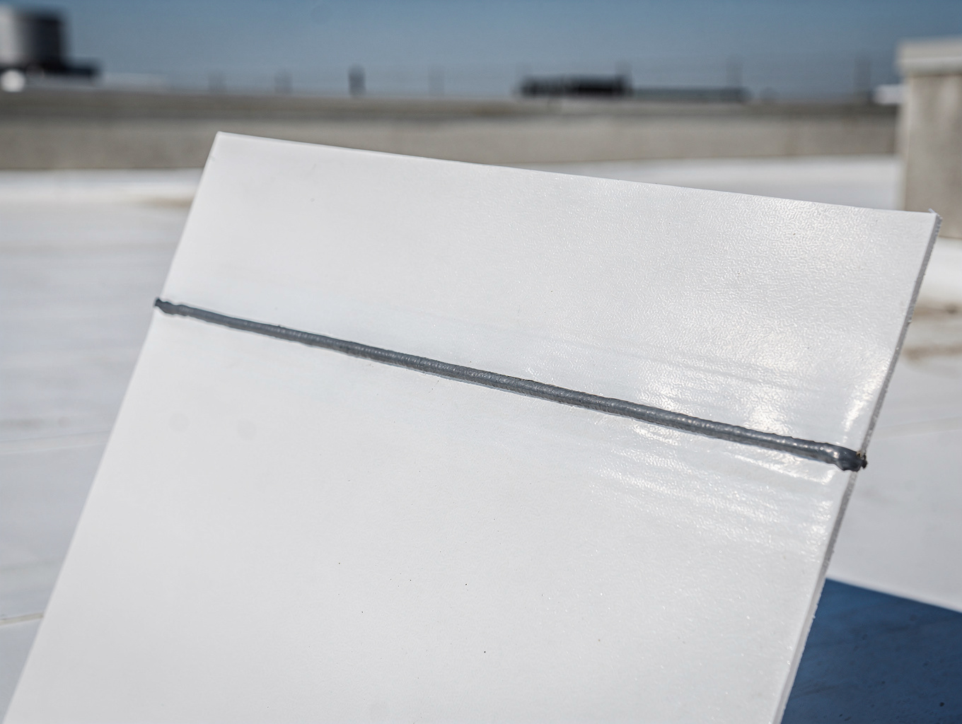 Repaired commercial roof with new TPO membrane and flashing