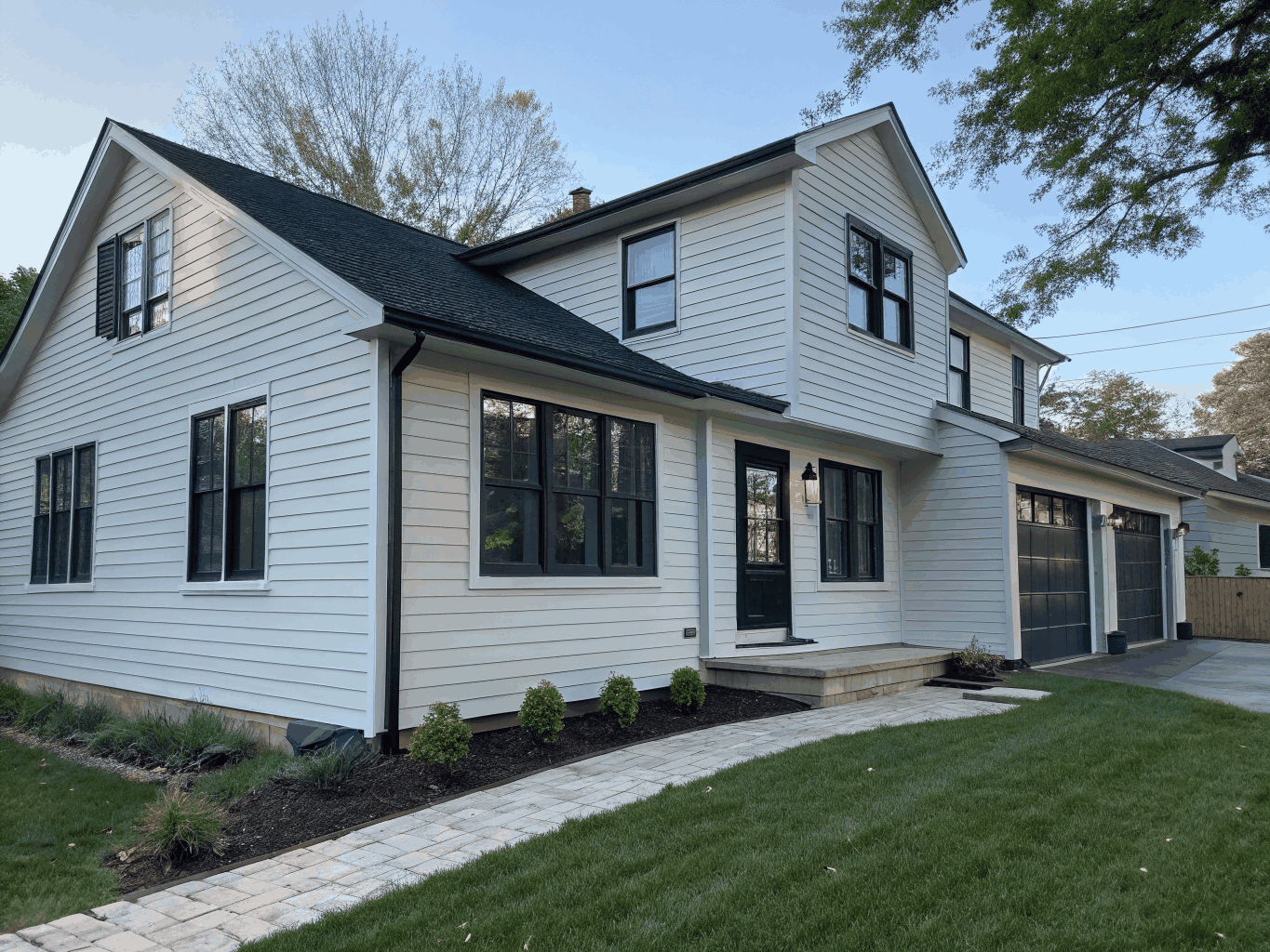 Modernized home with new fiber cement siding and stone accents