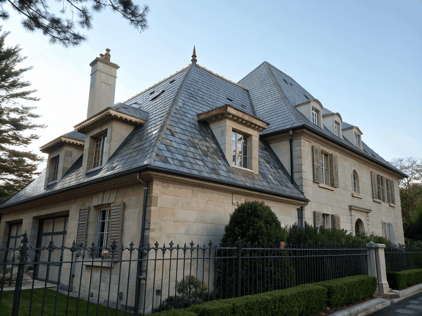 Historic Victorian home with damaged slate roof before restoration
